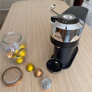 Nespresso Black and Silver Coffee Maker with Gold Capsules
